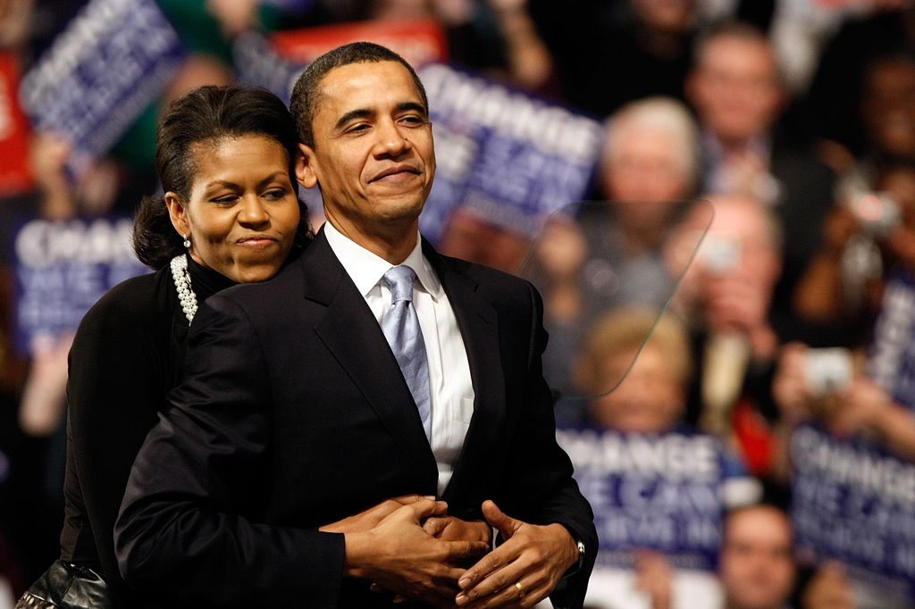 Democratic presidential hopeful Sen. Barack Obama (D-IL) is hugged by his wife Michelle Obama before his speech at a primary night rally in the gymnasium at the Nashua South High School on January 8, 2008 in Nashua, New Hampshire. Obama finished a projected 2nd place behind Sen. Hillary Clinton (D-NY) in the nation's first democratic primary