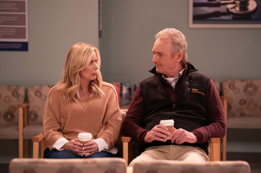 man and woman sitting in waiting room