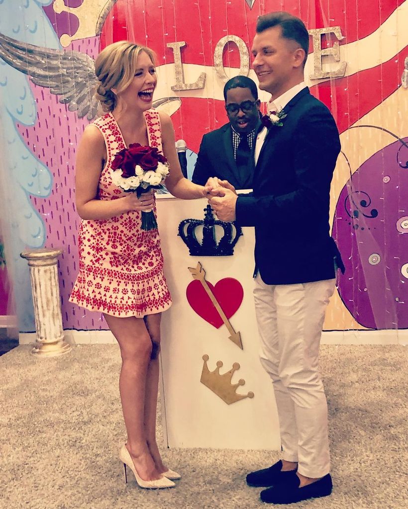 Rachel Riley laughing as she holds hands with Pasha during their Las Vegas wedding ceremony