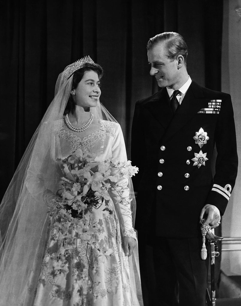 Queen Elizabeth with phillip in wedding outfits