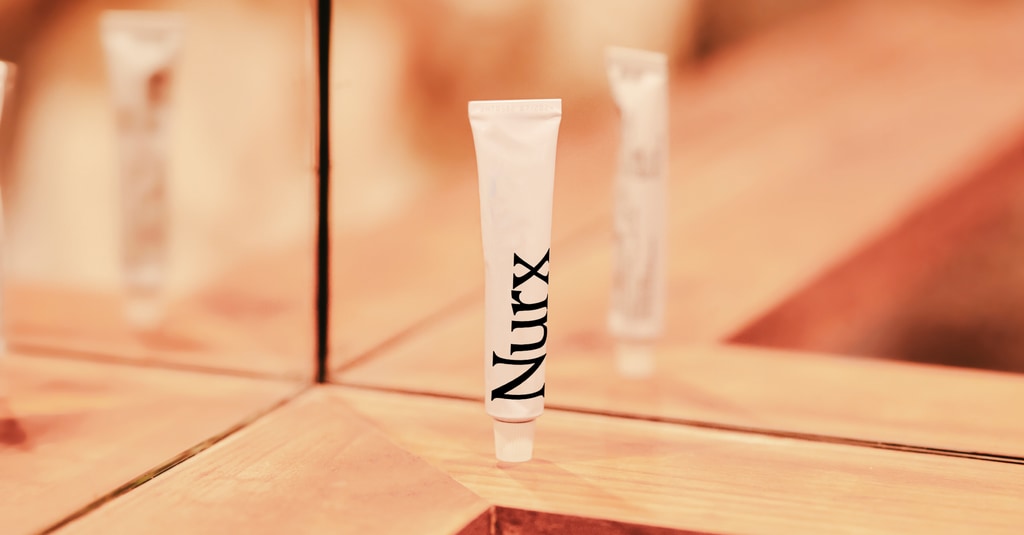 Nurx cream on bathroom shelf