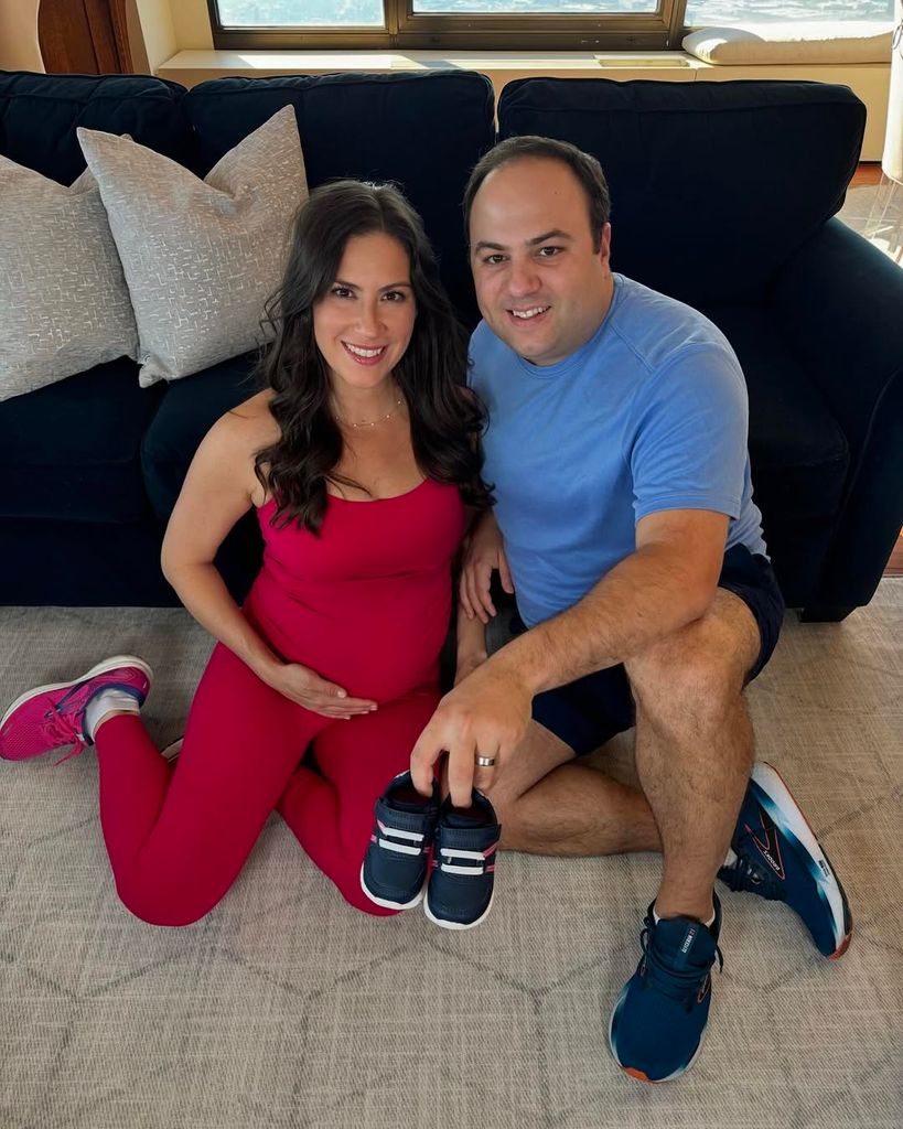 Stephanie Mansour and husband Nicholas Branoff hold baby shoes in a photo announcing their pregnancy, shared on Instagram