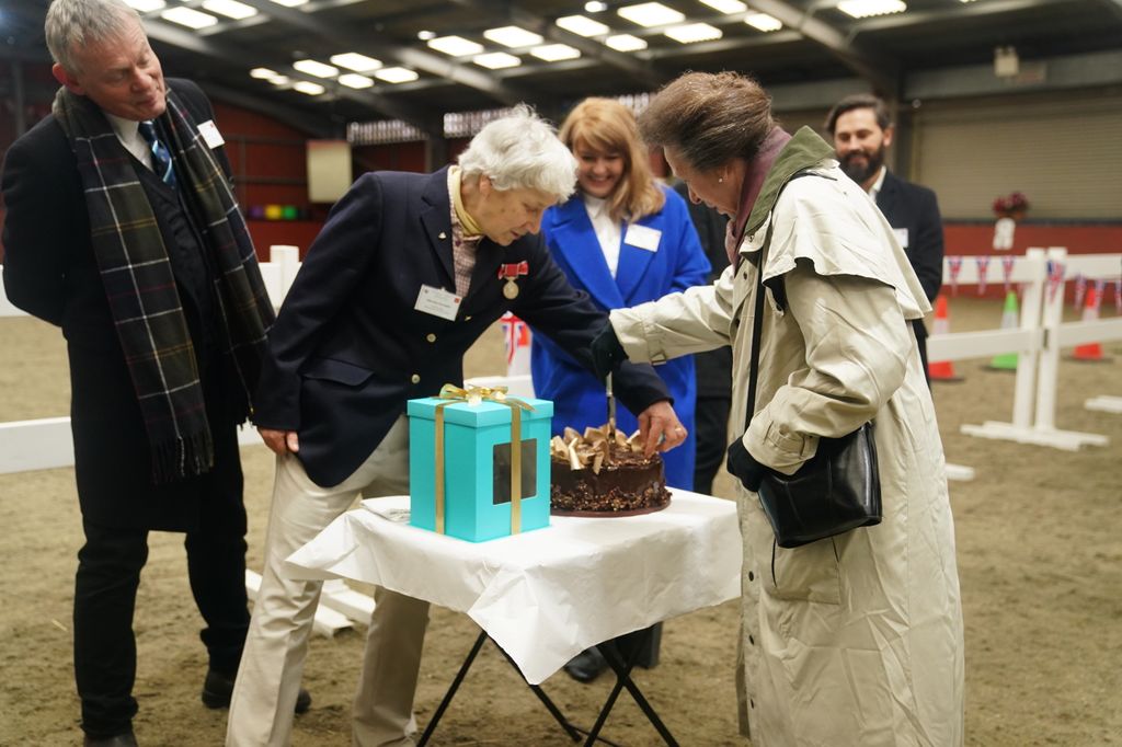Princess Anne cuts cake at pony club