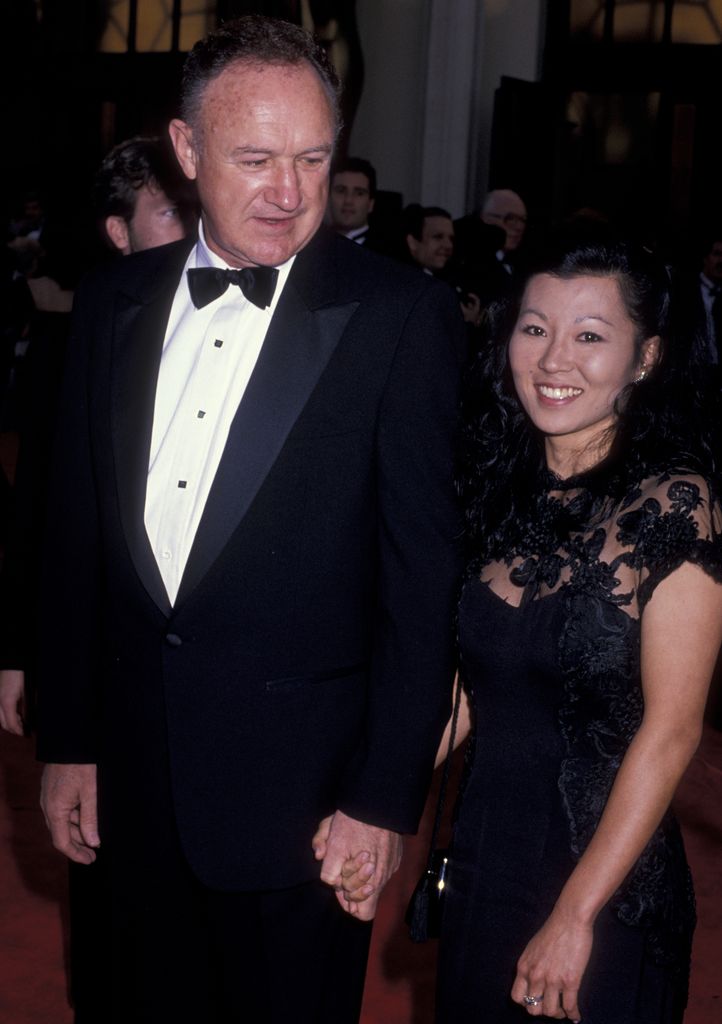 Gene Hackman and wife Betsy smiling red carpet