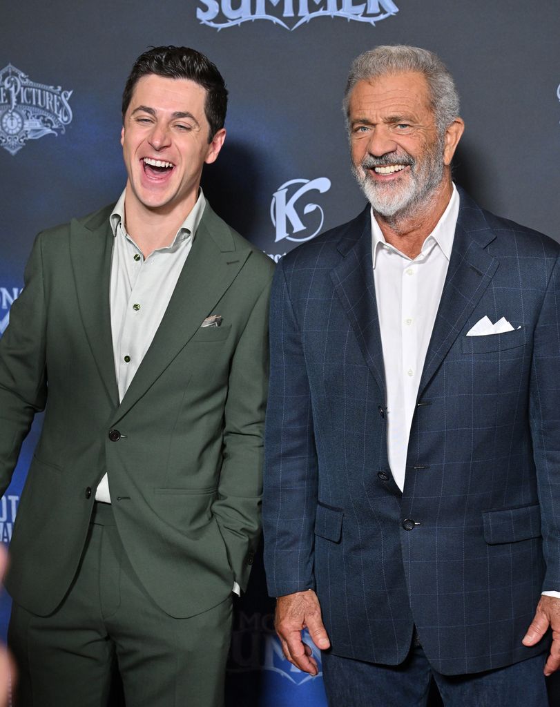 A photo of Mel Gibson and David Henrie 