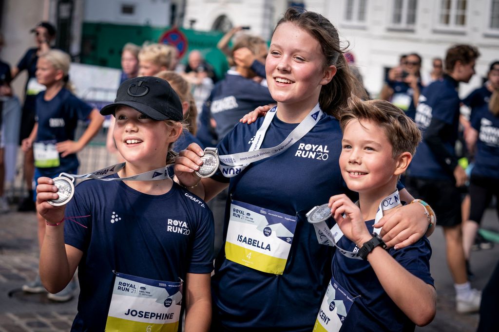 Princess Josephine, Princess Isabella and Prince Vincent react after running along one mile during the Royal Run in Copenhage
