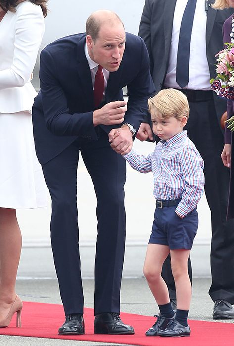 prince william talks to prince george outside airplane in poland