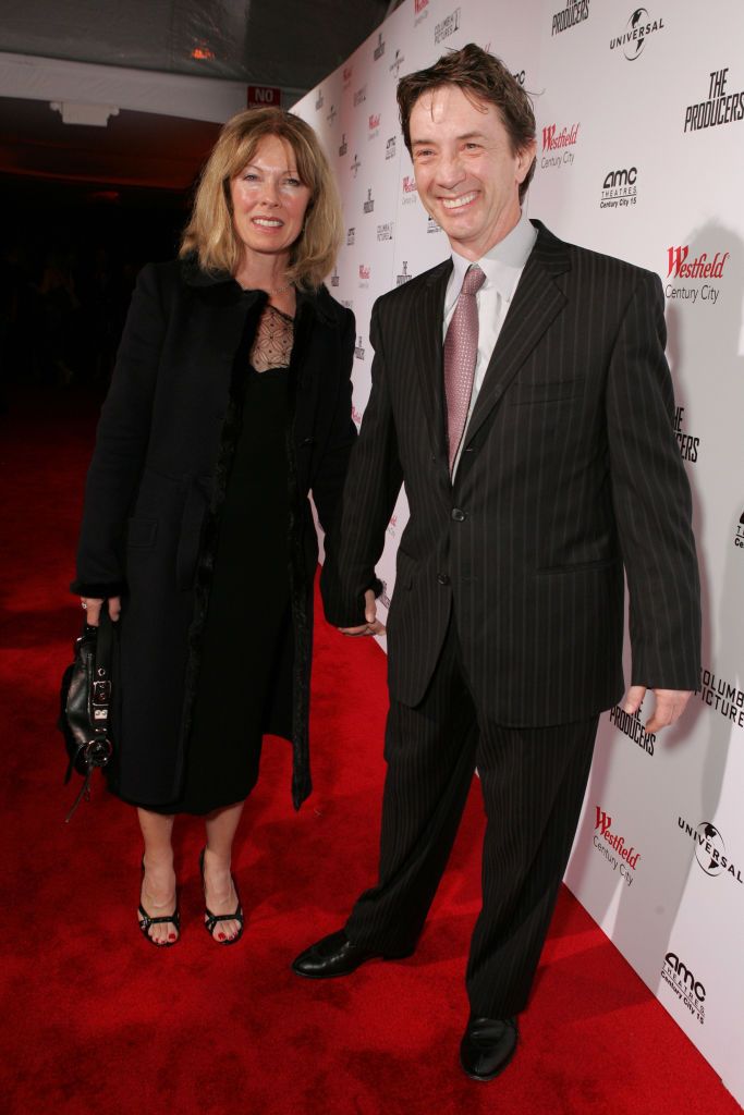 Martin Short and Nancy Dolman holding hands at a red carpet premiere