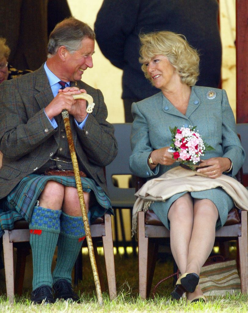 CAITHNESS, SCOTLAND - AUGUST 7: HRH The Prince of Wales and Camilla Parker Bowles enjoy a lighter moment during the tug of war at the 2004 Mey Games at Queens Park in Mey on August 7, 2004 in Caithness, Scotland. HRH Prince of Wales is the Honoraray president of the annual contest, which includes events such as Heavy Events, Track and Field, Solo Piping and Highland Dancing. He is staying at the Castle of Mey, the summer home of his late grandmother, Queen Elizabeth the Queen Mother. (Photo by Christopher Furlong/Getty Images)