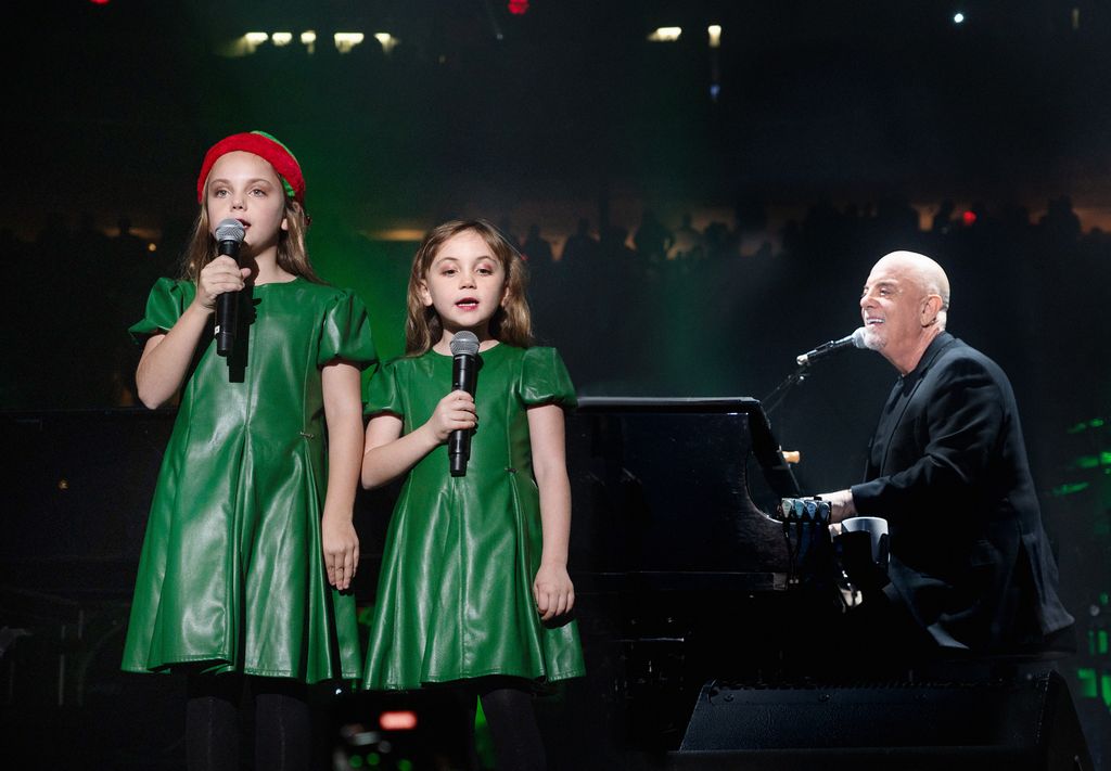  Billy Joel (R) performs with his daughters Della Joel and Remy Joel at Madison Square Garden 
