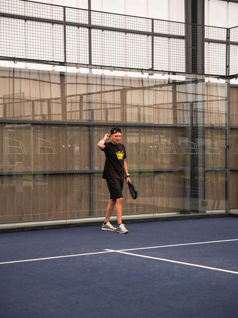 Aitch playing padel