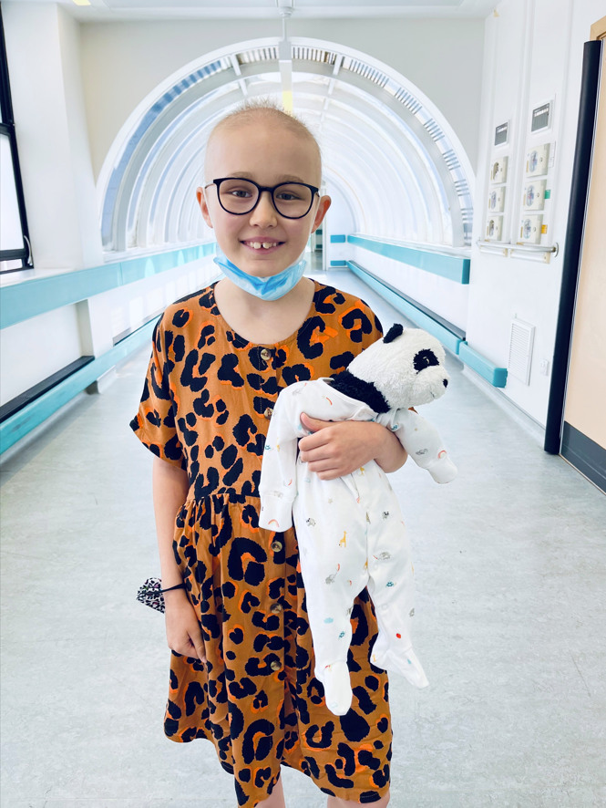 girl in hospital in animal print dress