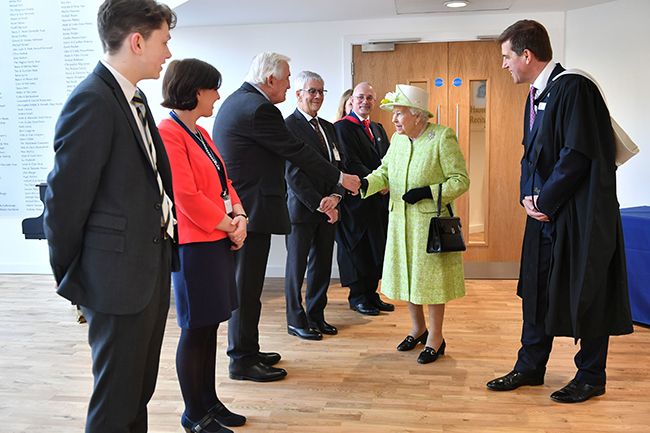 the queen shakes hand with sophie wessex dad