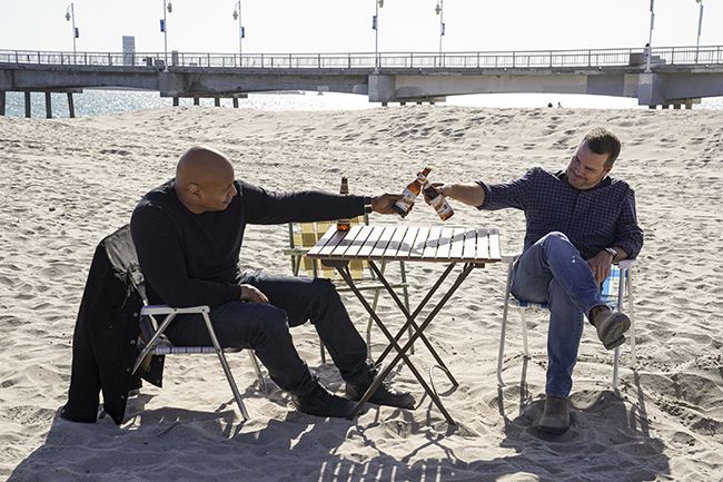 Callen and Sam cheers on beach