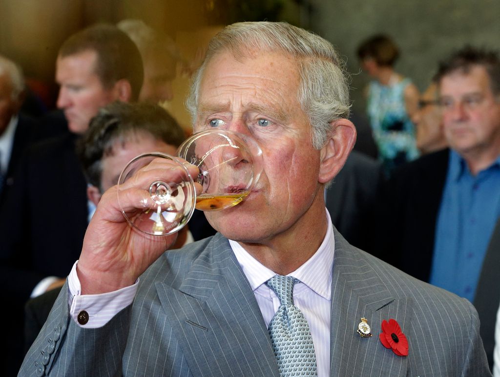King Charles drinking wine