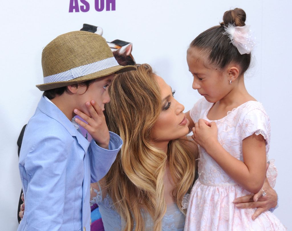 Jennifer Lopez talks to Emme and MAx at an event when they were young