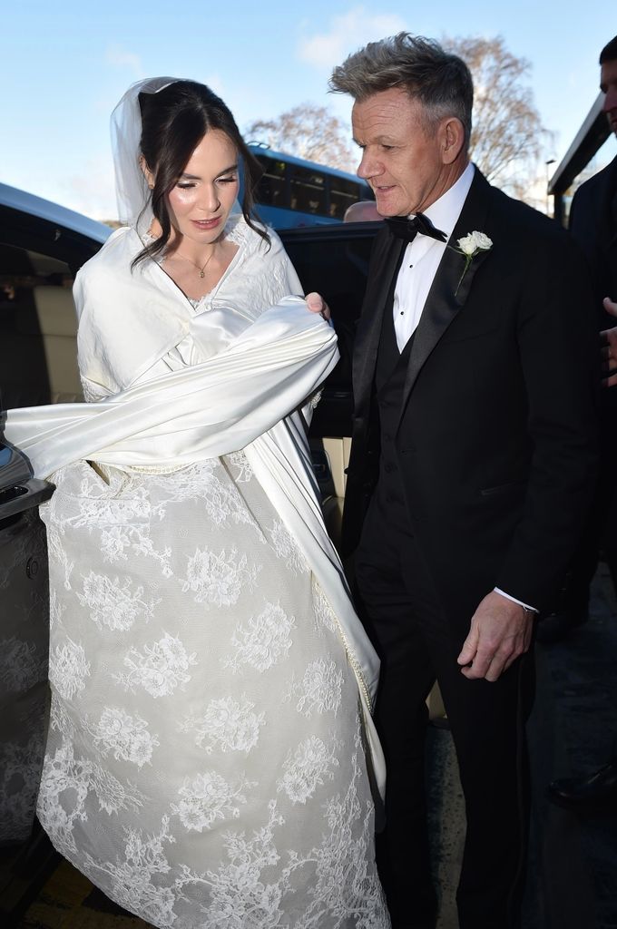 Holly Ramsay and her father Gordon Ramsay are pictured arriving at Bath Abbey for her wedding to Olympian Adam Peaty