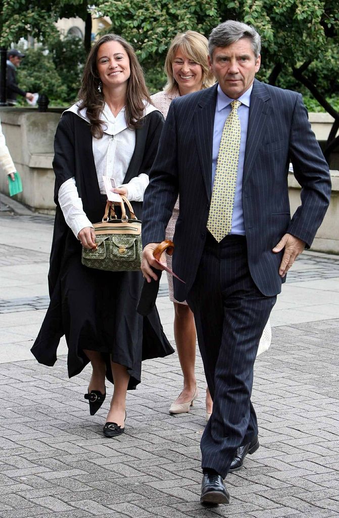 Pippa with her parents on her graduation day