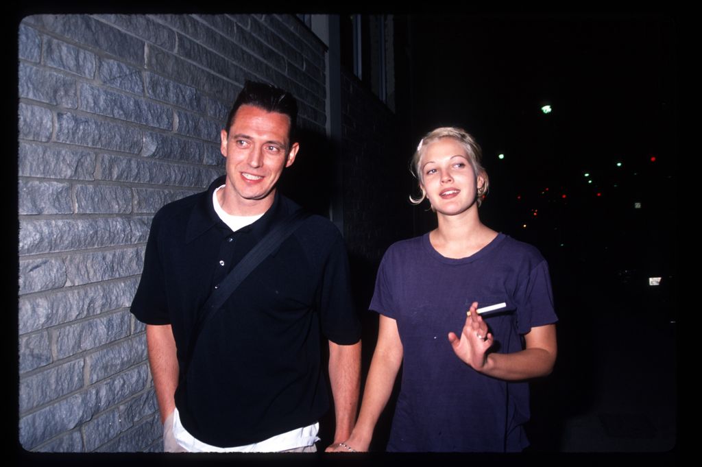 Drew Barrymore in a blue T-shirt with husband Jeremy Thomas