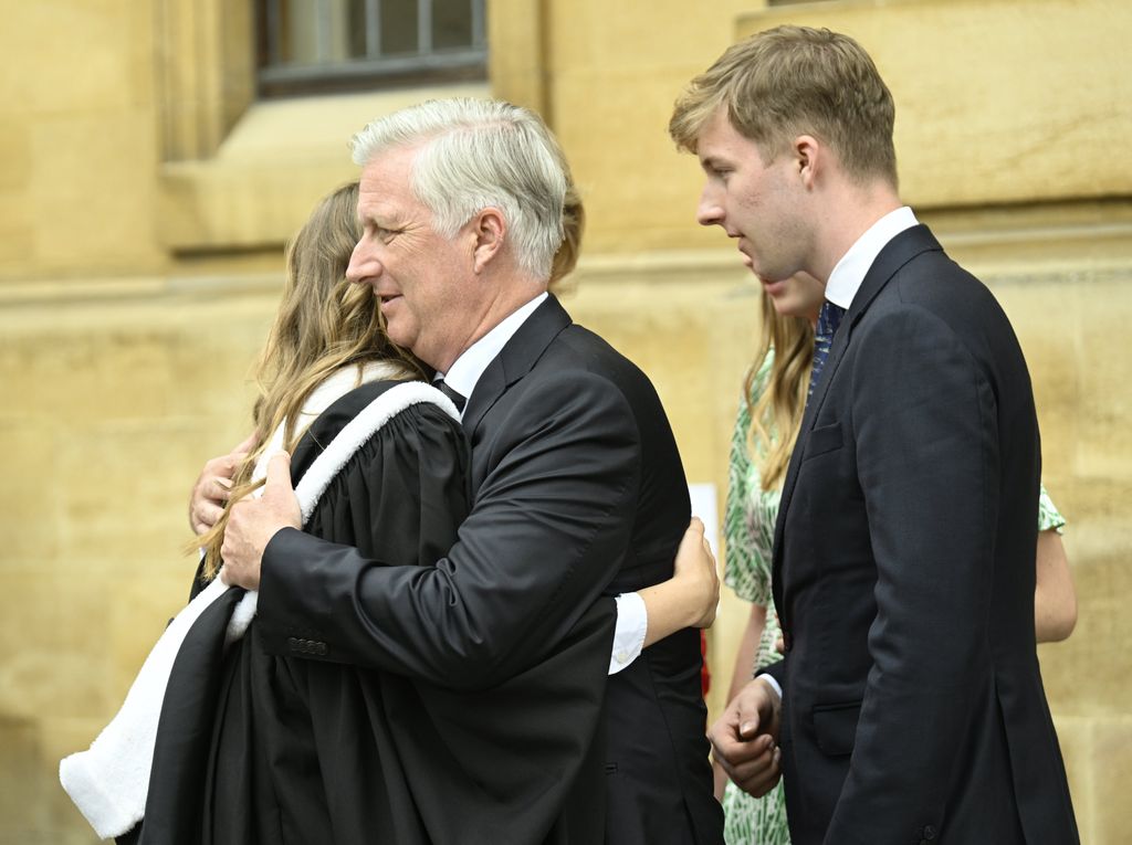 King Philippe hugs Princess Elisabeth