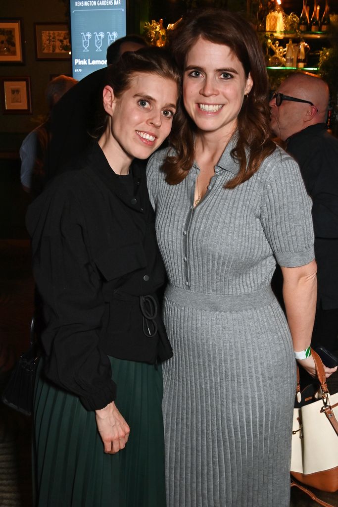 Princess Beatrice and Princess Eugenie embracing