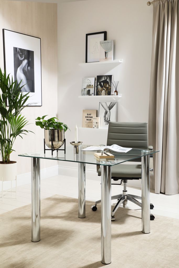 A neutral office with glass desk