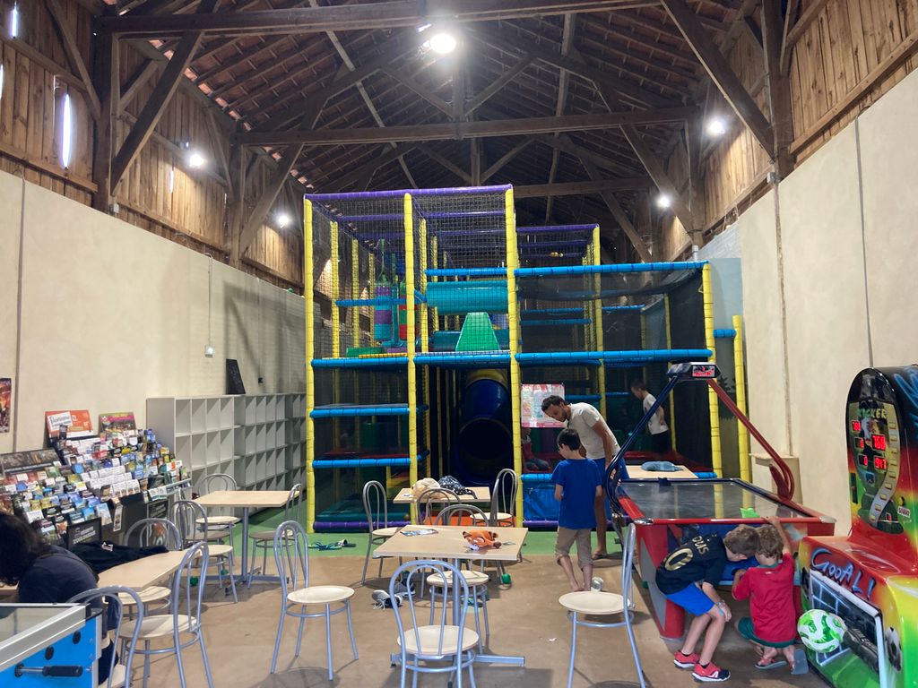 Hall with softplay cage and chairs and tables