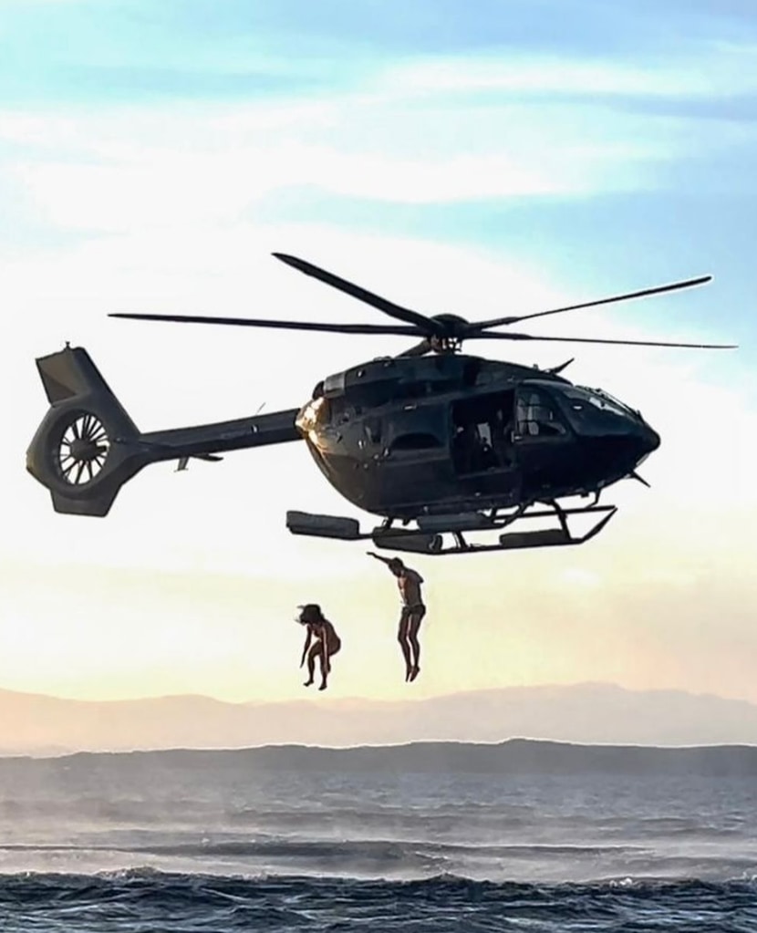 Photo shared by Katy Perry on Instagram August 2024 of her and Orlando Bloom jumping from a helicopter into the ocean