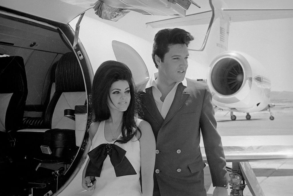 Newlyweds Elvis and Priscilla Presley, who met while Elvis was in the Army, prepare to board their private jet following their wedding at the Aladdin Resort and Casino in Las Vegas, 1967