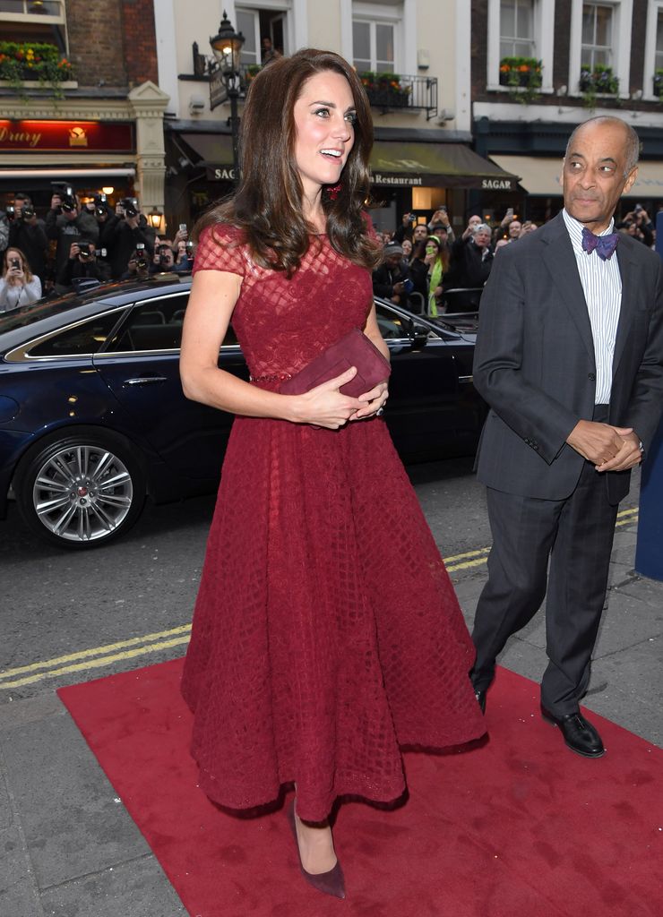 Kate arriving at theatre in red dress