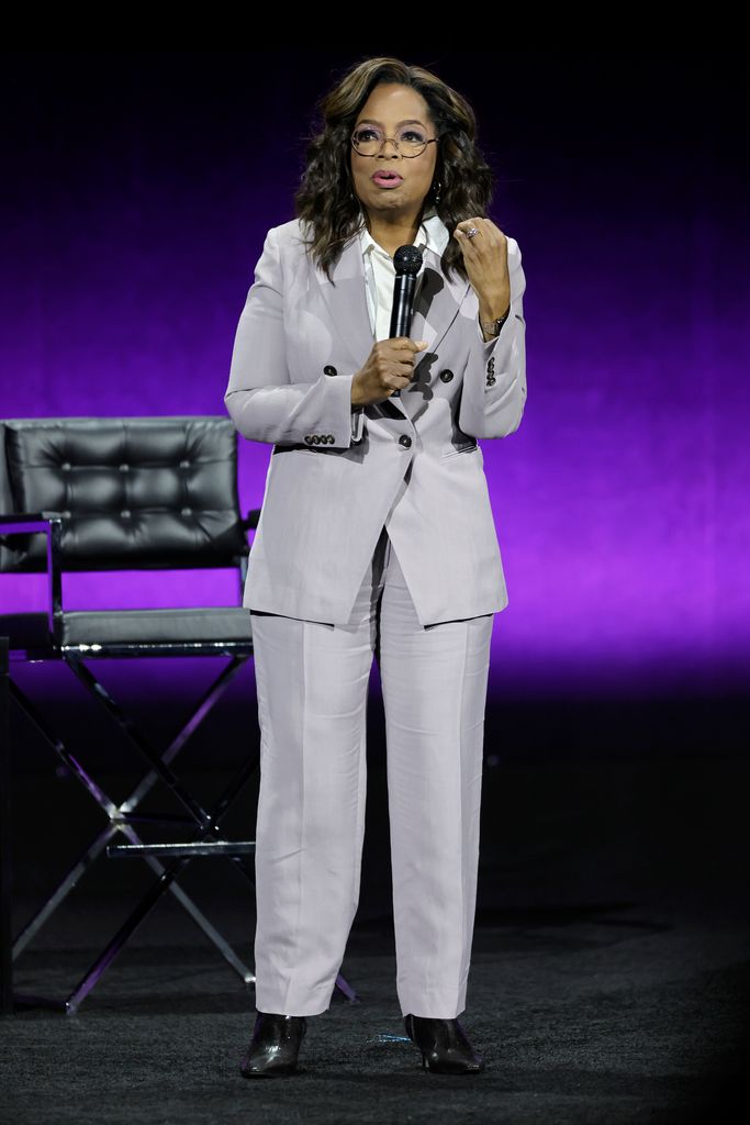 oprah winfrey purple suit on stage cinemacon 2023