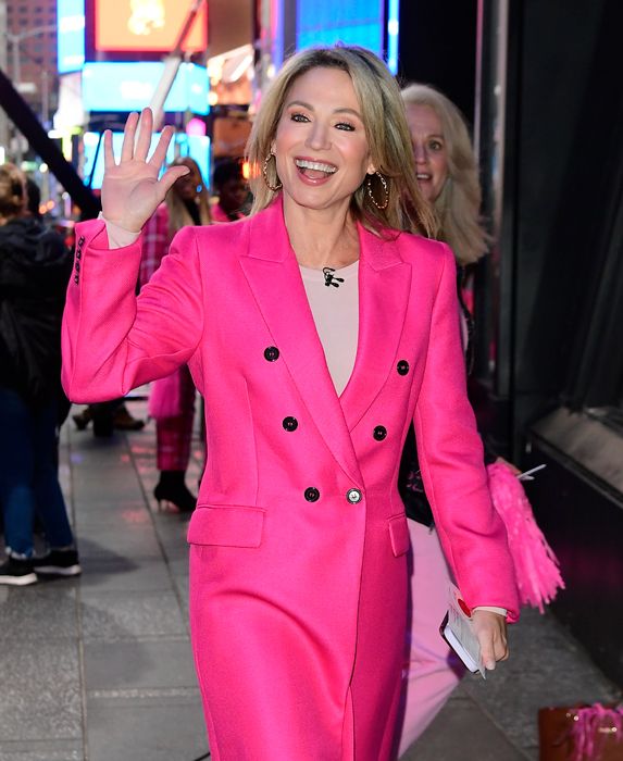 amy robach waving in a pink suit