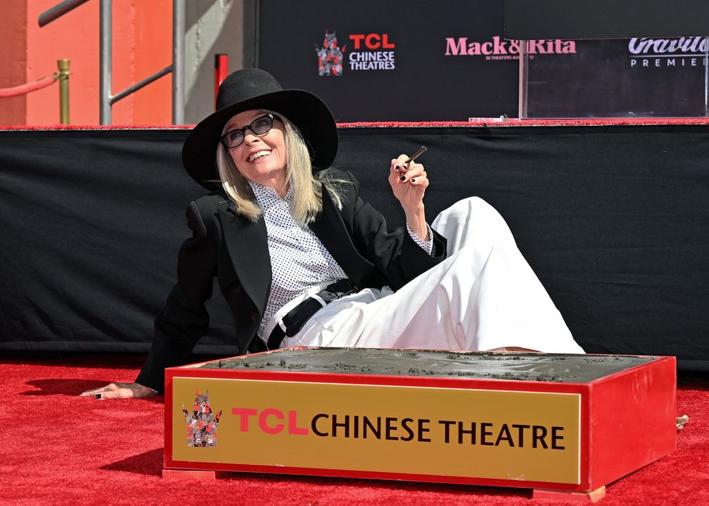 Diane Keaton is honored with a Hand and Footprint Ceremony at TCL Chinese Theatre wearing polka dot shirt and black blazer