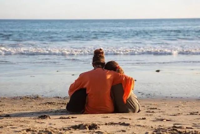 Halle Berry cuddling her children on the beach