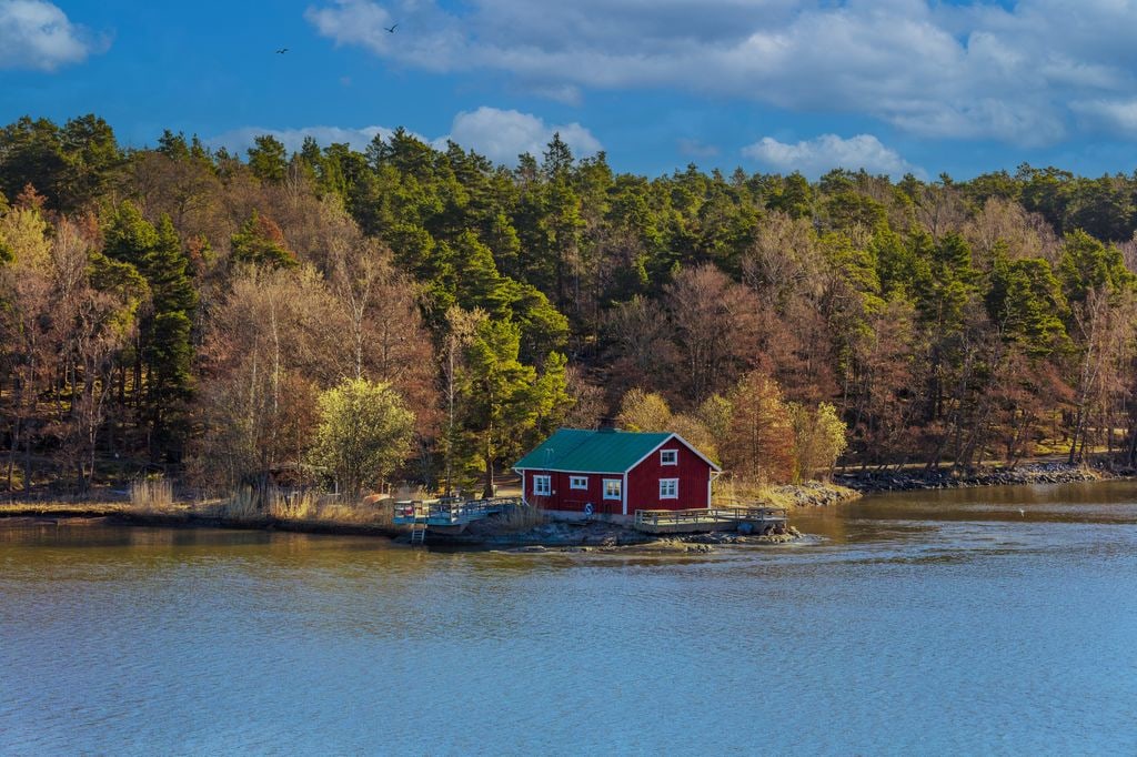 An idyllic red cabin and beach surrounded by beautiful sea views, archipelago scenery, Ruissalo, Turku, Finland