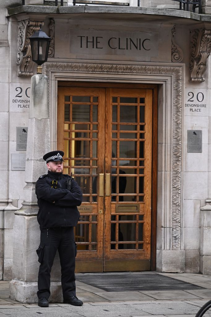 A Police officer stands guard at the entrance to The London Clinic after news of the Princess of Wales' admission was shared