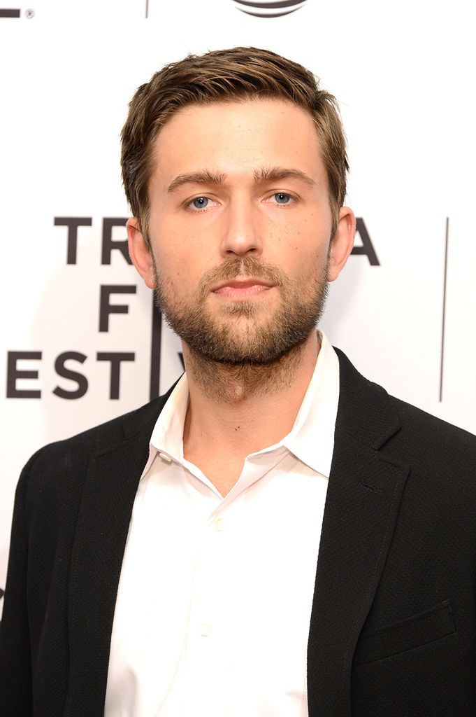 Brandon Sklenar wearing a black blazer and white shirt