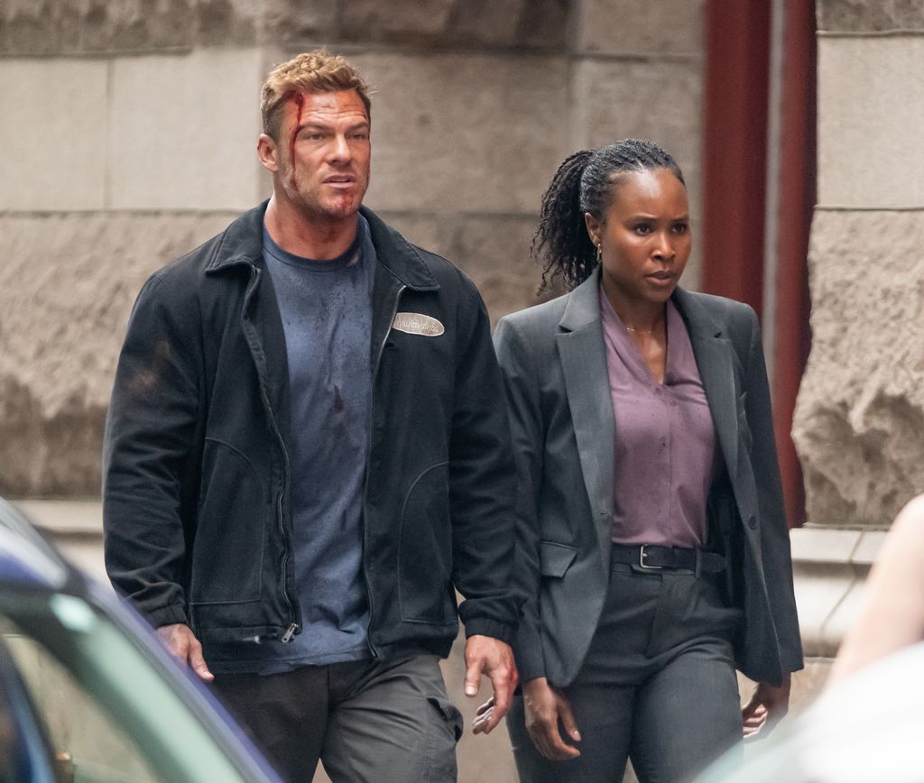 Alan Ritchson and Sydelle Noel are seen filming scenes of the Amazon Prime Video TV series "Reacher" season 4 on June 18, 2025 in Philadelphia, Pennsylvania