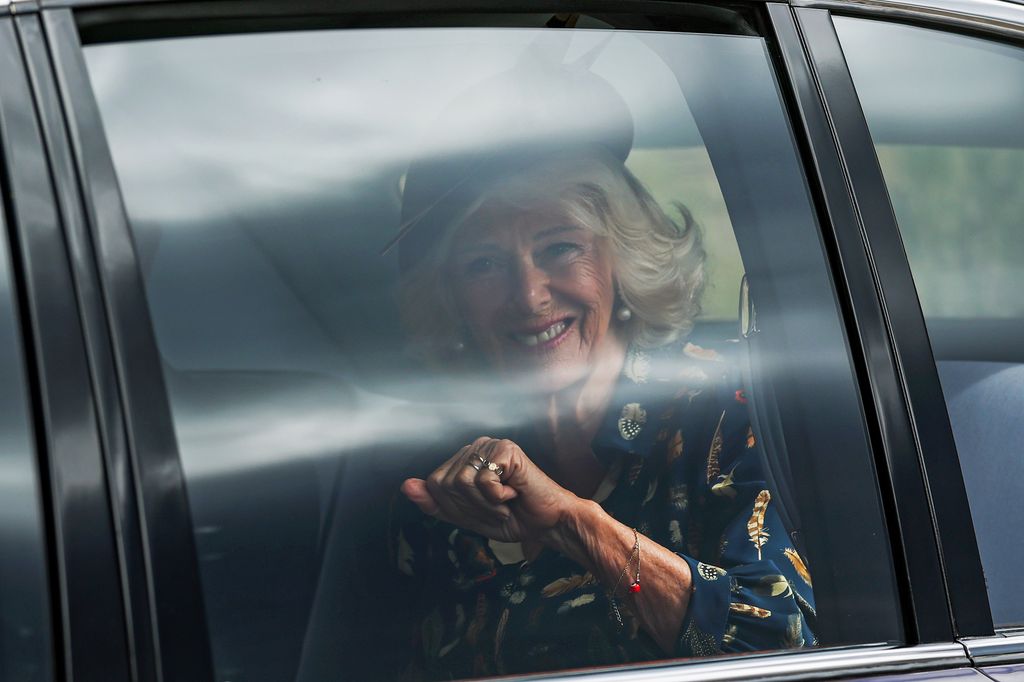 Queen Camilla smiling through car window