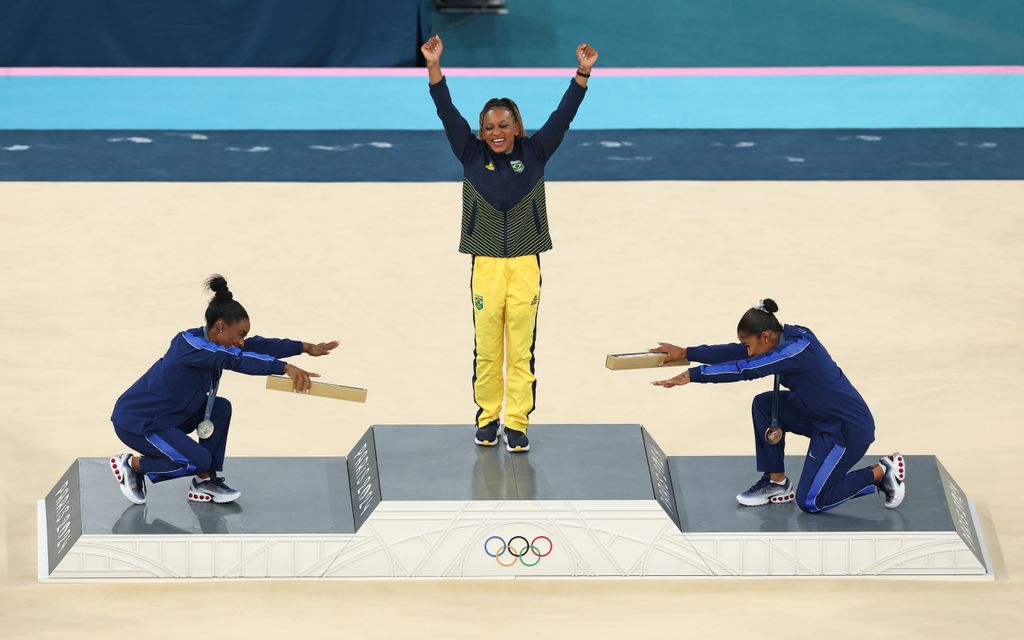 Gold medalist Rebeca Andrade (C) of Team Brazil, silver medalist Simone Biles (L) of Team United States and bronze medalist Jordan Chiles (R) of Team United States celebrate on the podium at the Artistic Gymnastics Women's Floor Exercise Medal Ceremony on day ten of the Olympic Games Paris 2024 at Bercy Arena on August 05, 2024 in Paris, France.