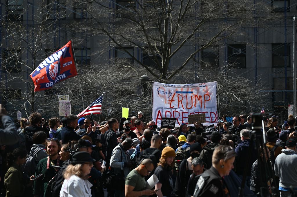 Opponents and supporters of former US president Donald Trump gather in New York on April 4, 2023