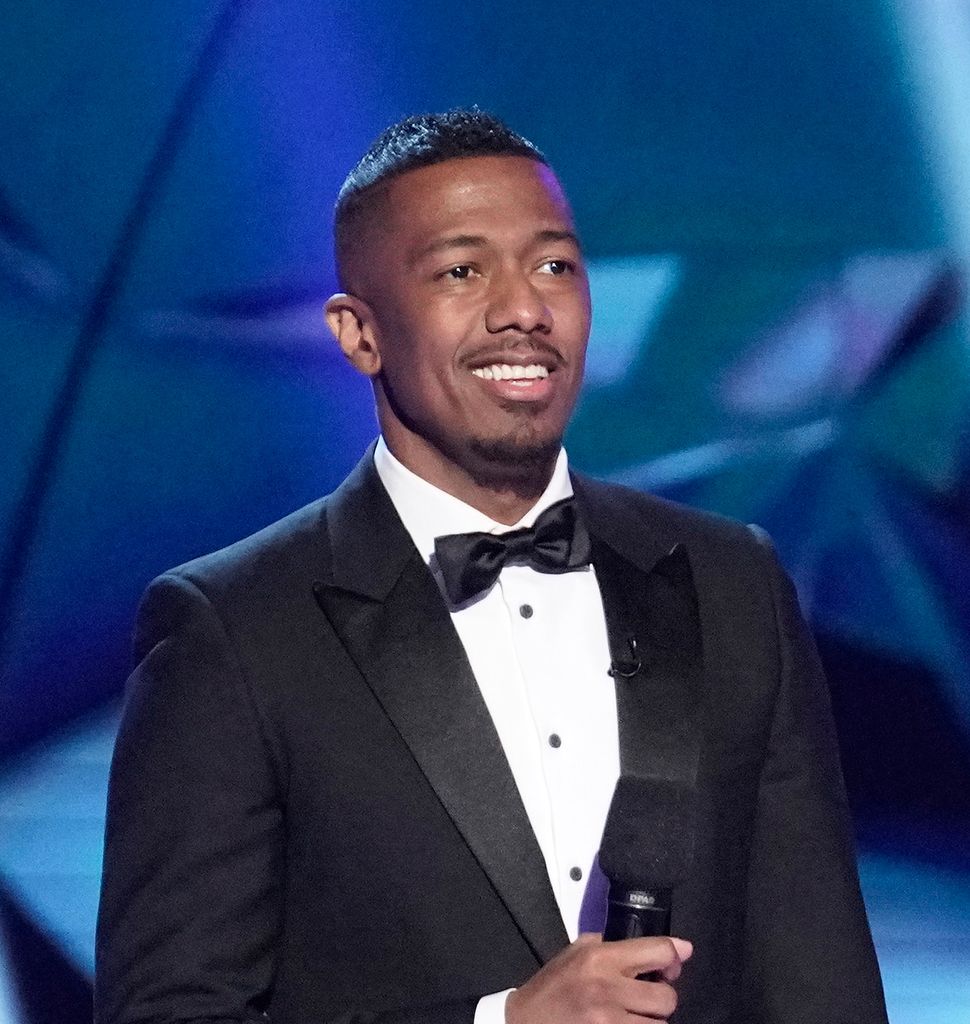 Host Nick Cannon and T-Rex in the It Never Hurts to Mask: Group C Playoffs episode of THE MASKED SINGER airing Wednesday, March 18