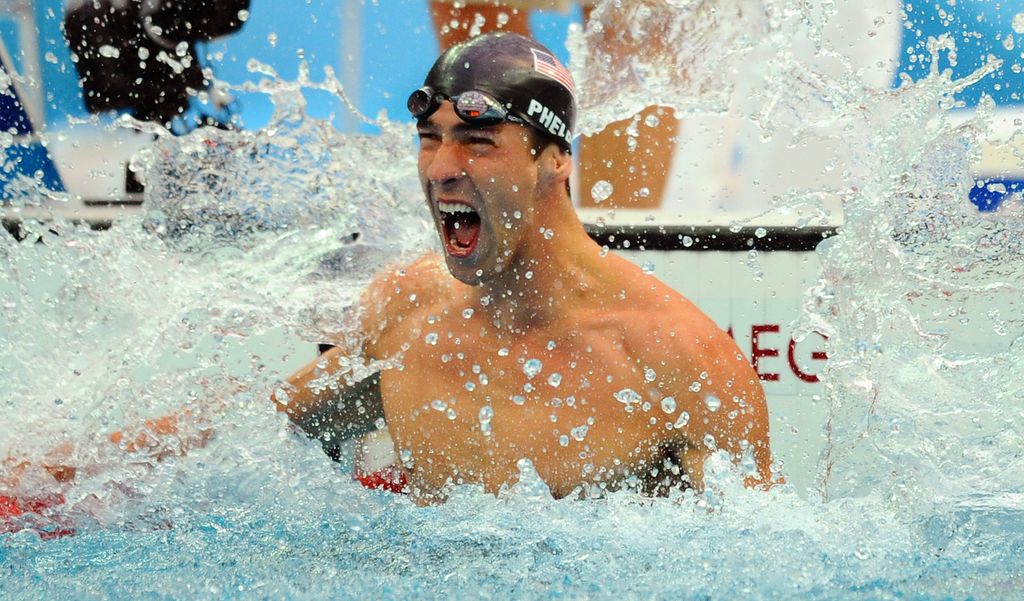 US swimmer Michael Phelps reacts after winning the men's 100m butterfly swimming final at the National Aquatics Center during the 2008 Beijing Olympic Games in Beijing
