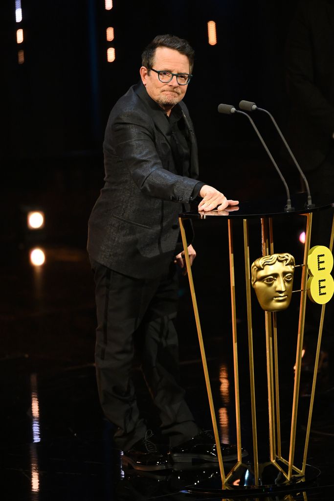 Michael J Fox presents the Best Film Award on stage during the EE BAFTA Film Awards 2024