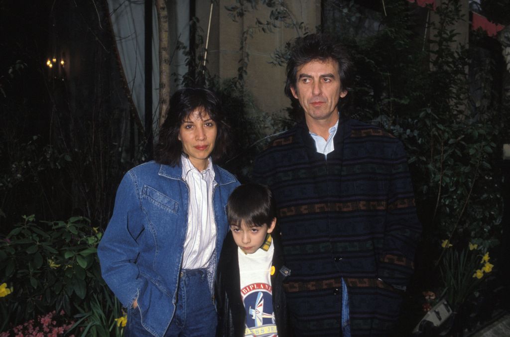 Woman and man with young boy outside 