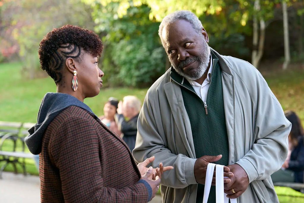 Still from Ripple with Frankie Faison talking to a woman in a park