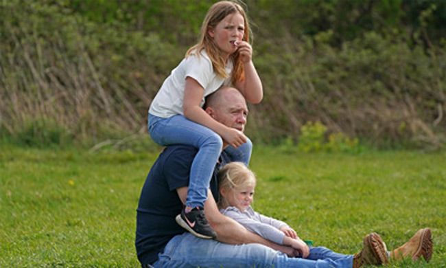 Mike Tindall sits with his two daughters, Mia and Lena