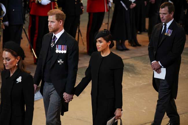 meghan harry coffin holding hands