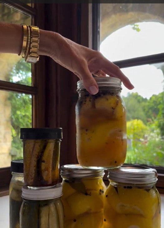 Meghan Markle holding a jar of preserved lemons