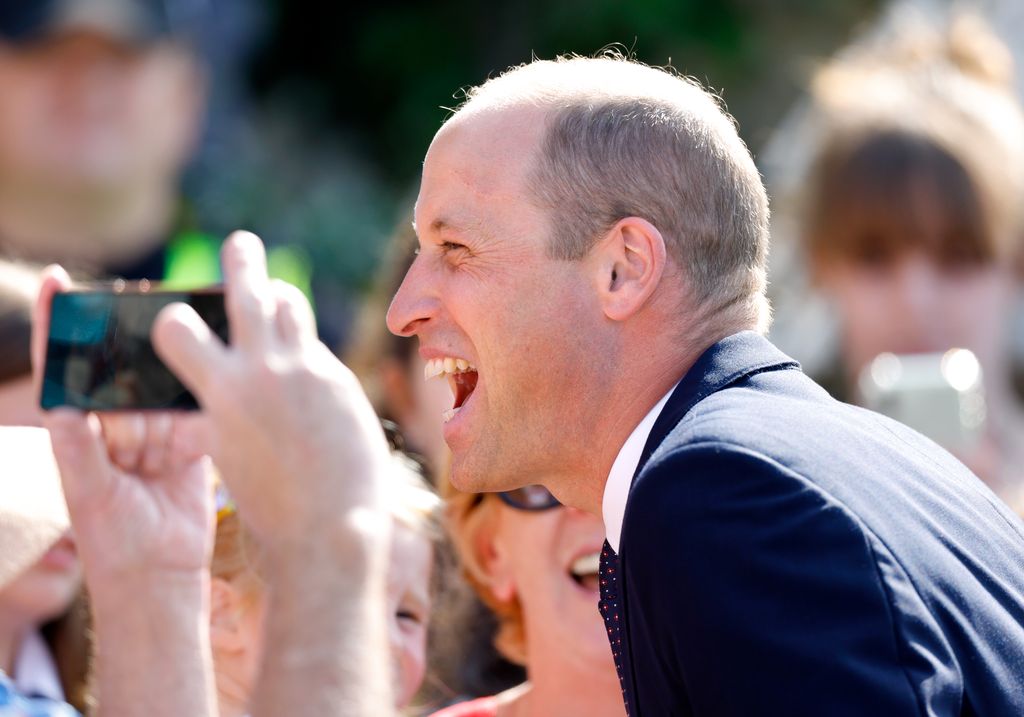 Prince William side profile laughing